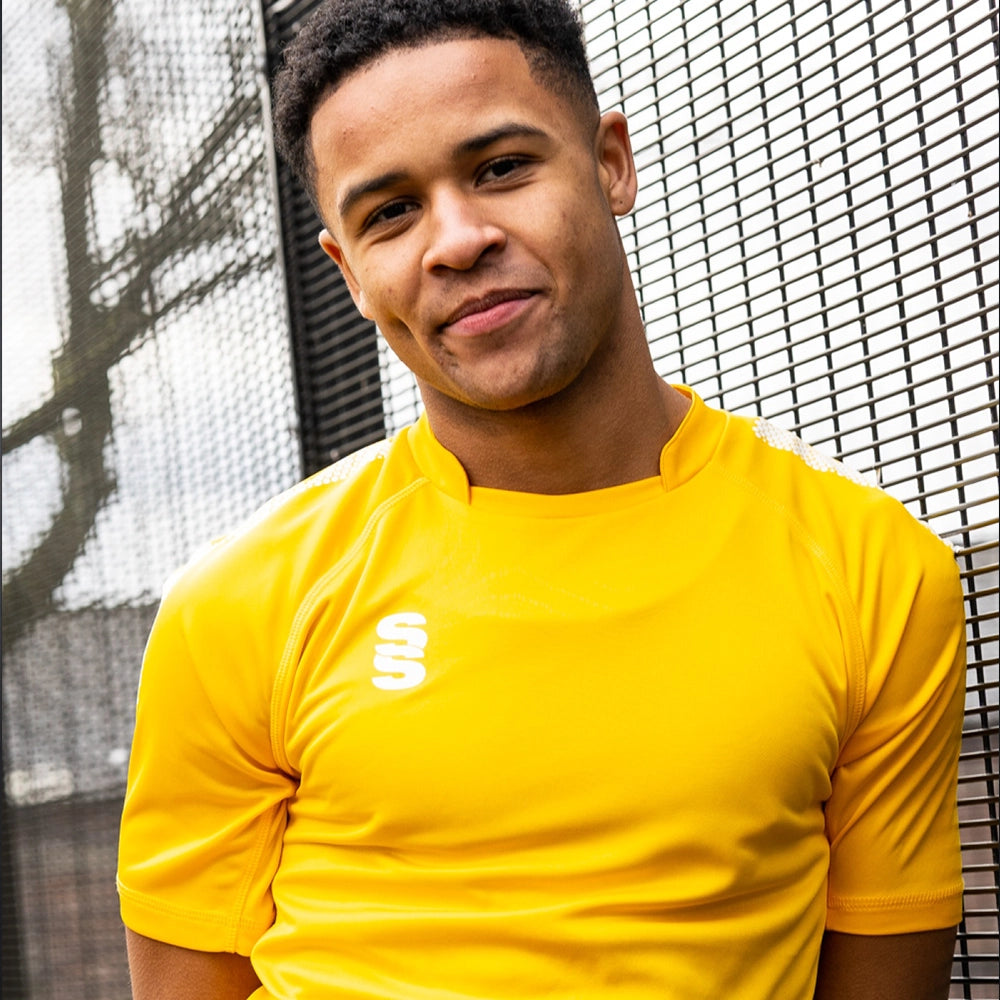 Model wearing the Stuart Surridge Dual Games Shirt in Amber