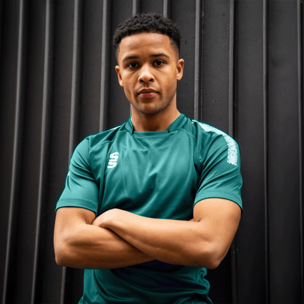 Man wearing the Surridge Sport Dual Games Shirt in Bottle Green