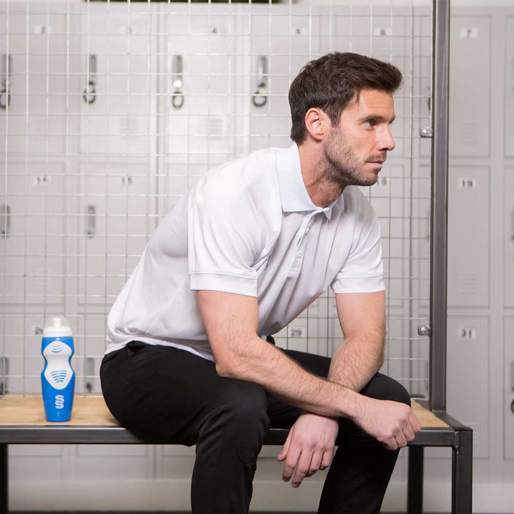 model wearing Stuart Surridge Dual Solid Colour Polo - White