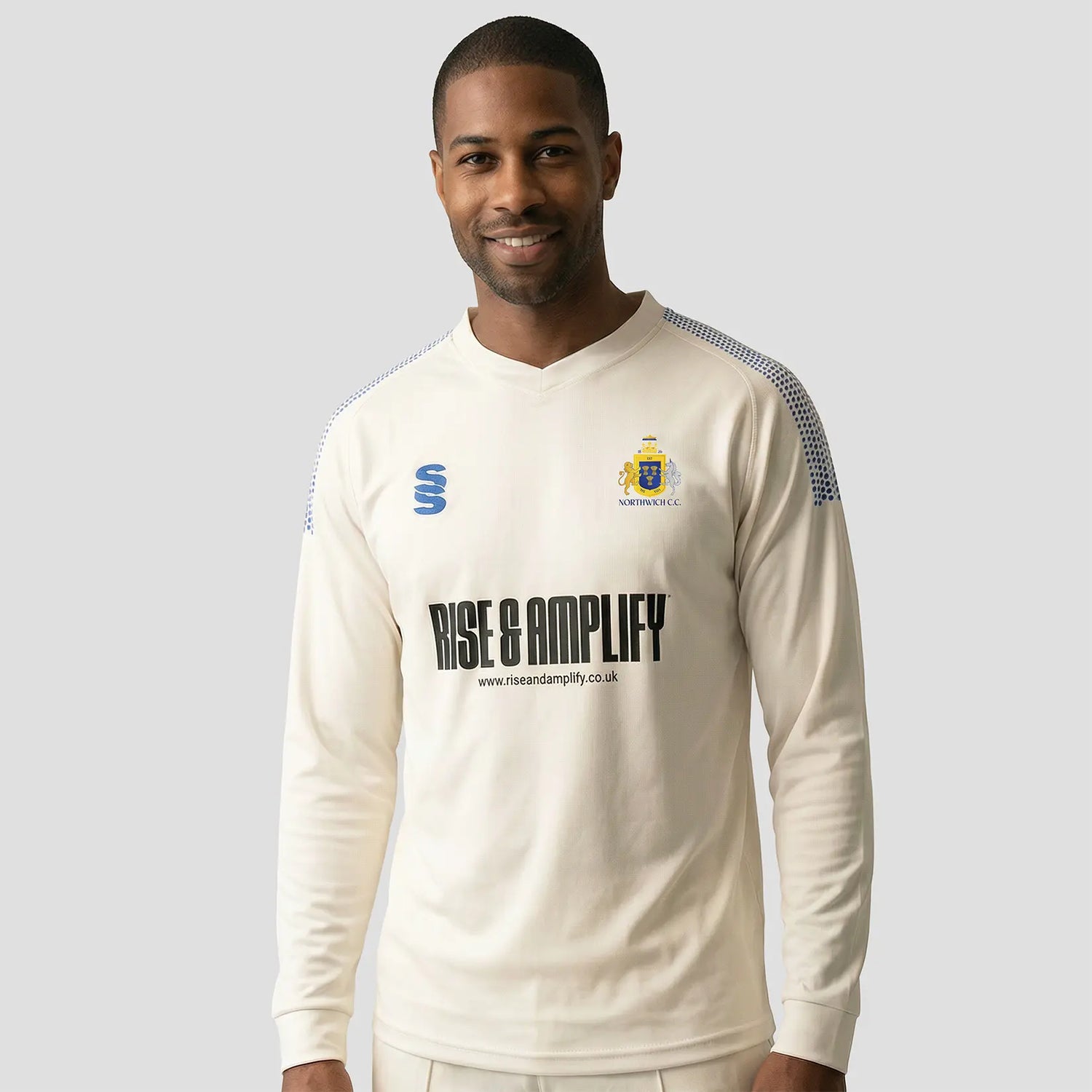 Model wearing the Northwich Cricket Club Long Sleeve Cricket Sweater - Adult