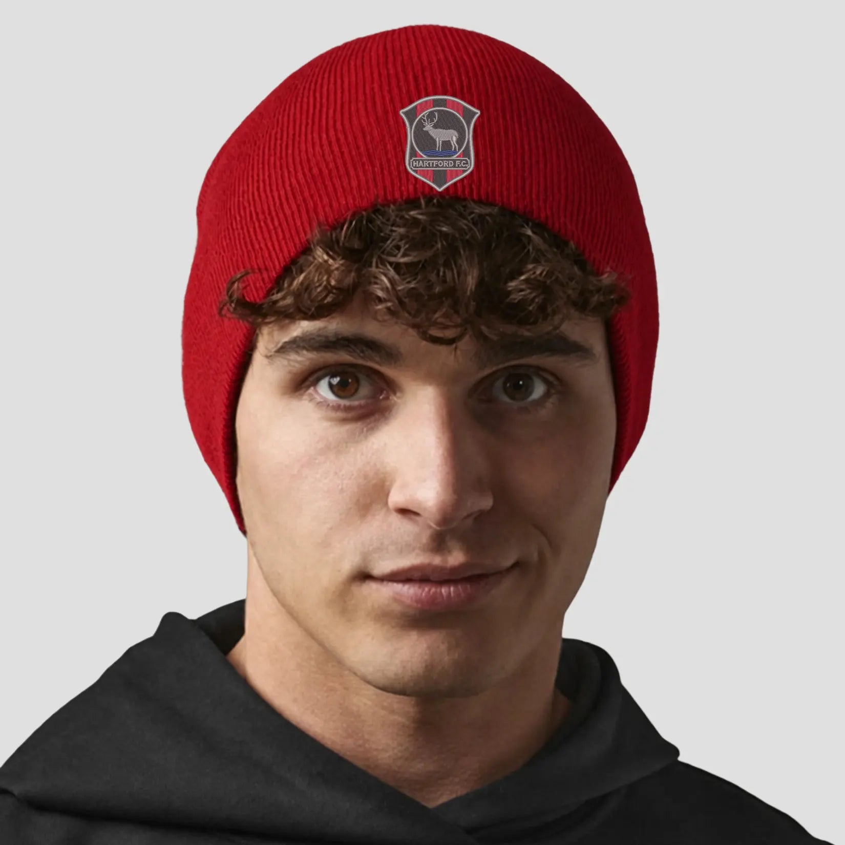 Model wearing the Hartford Football Club Beanie (Classic Red)
