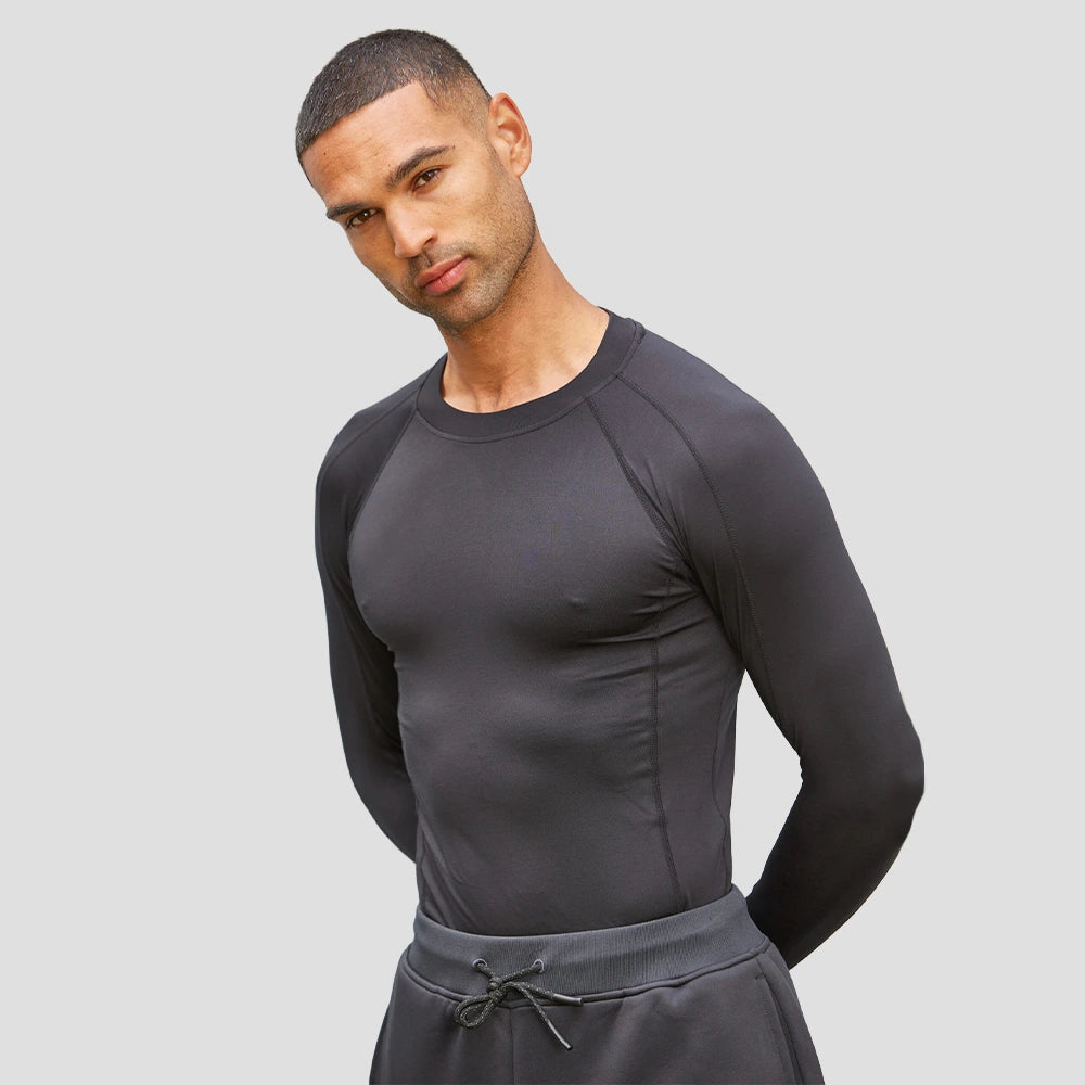Male Model wearing the Hawks Netball Club Baselayer – Adult
