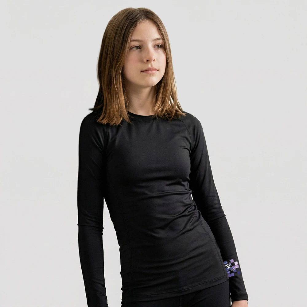 Model wearing the Hawks Netball Club Baselayer – Junior