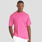 Model wearing the AWDis Cool T-Shirt JC001 in Electric Pink