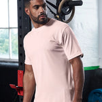 Model wearing the Model wearing the AWDis Cool T-Shirt JC001 in Pink