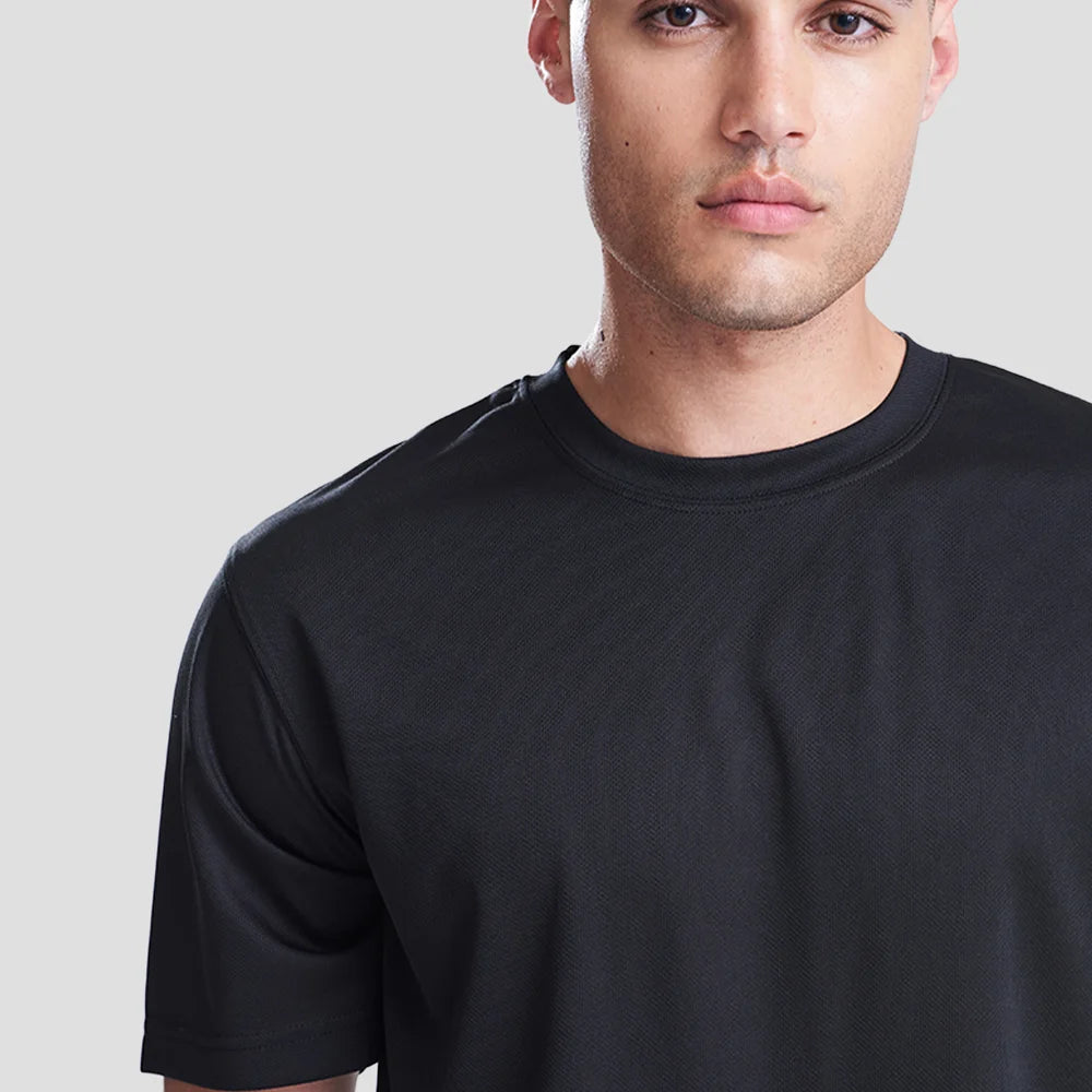 Close-up shot of Model wearing the AWDis Cool T-Shirt JC001 in Jet Black