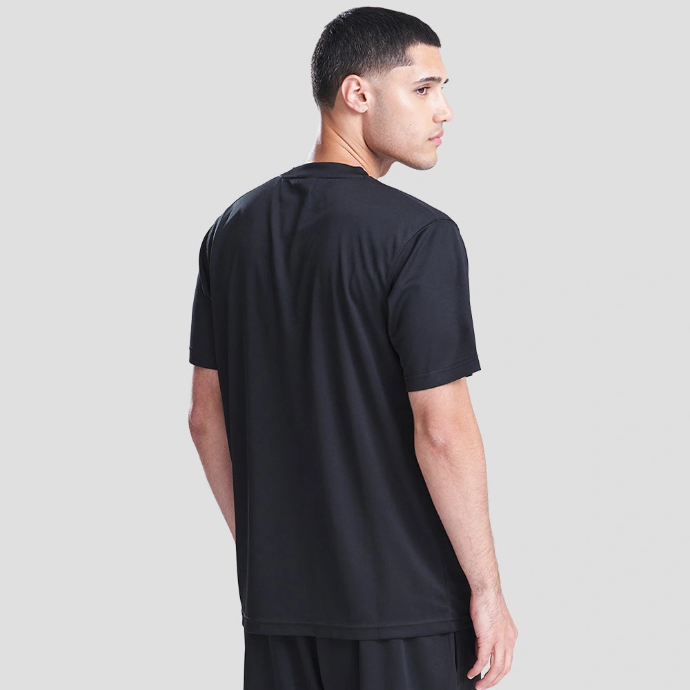 Rear view of Model wearing the AWDis Cool T-Shirt JC001 in Jet Black