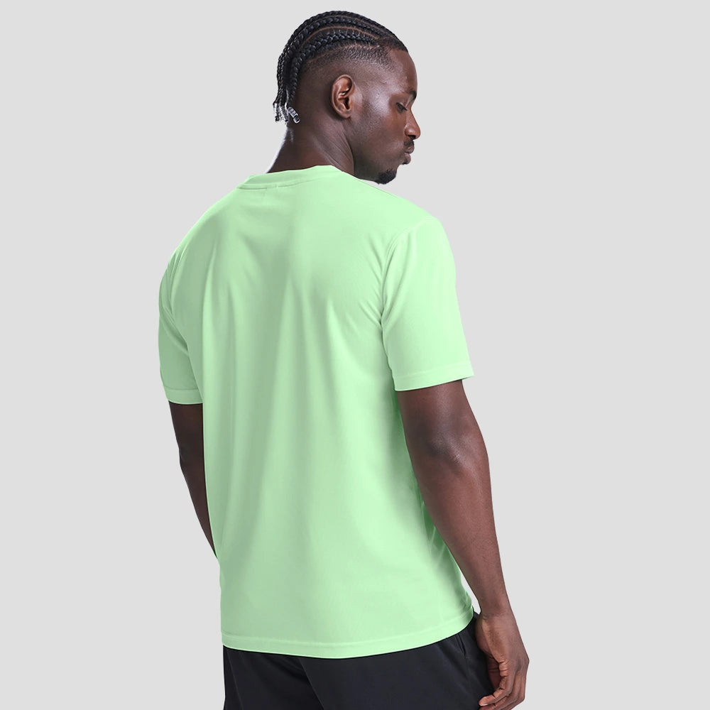 Rear view of Model wearing the AWDis Cool T-Shirt JC001 in Green