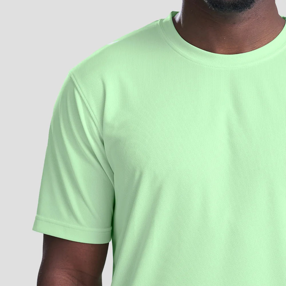 Close-up of Model wearing the AWDis Cool T-Shirt JC001 in Green