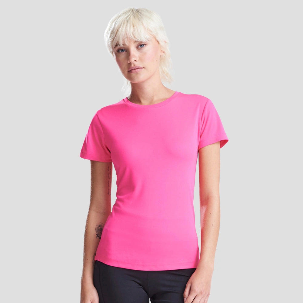 Model wearing the AWDis Ladies Cool T-Shirt JC005 in Hyper Pink