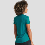 Rear view of Model wearing the AWDis Ladies Cool T-Shirt JC005 in Jade Green