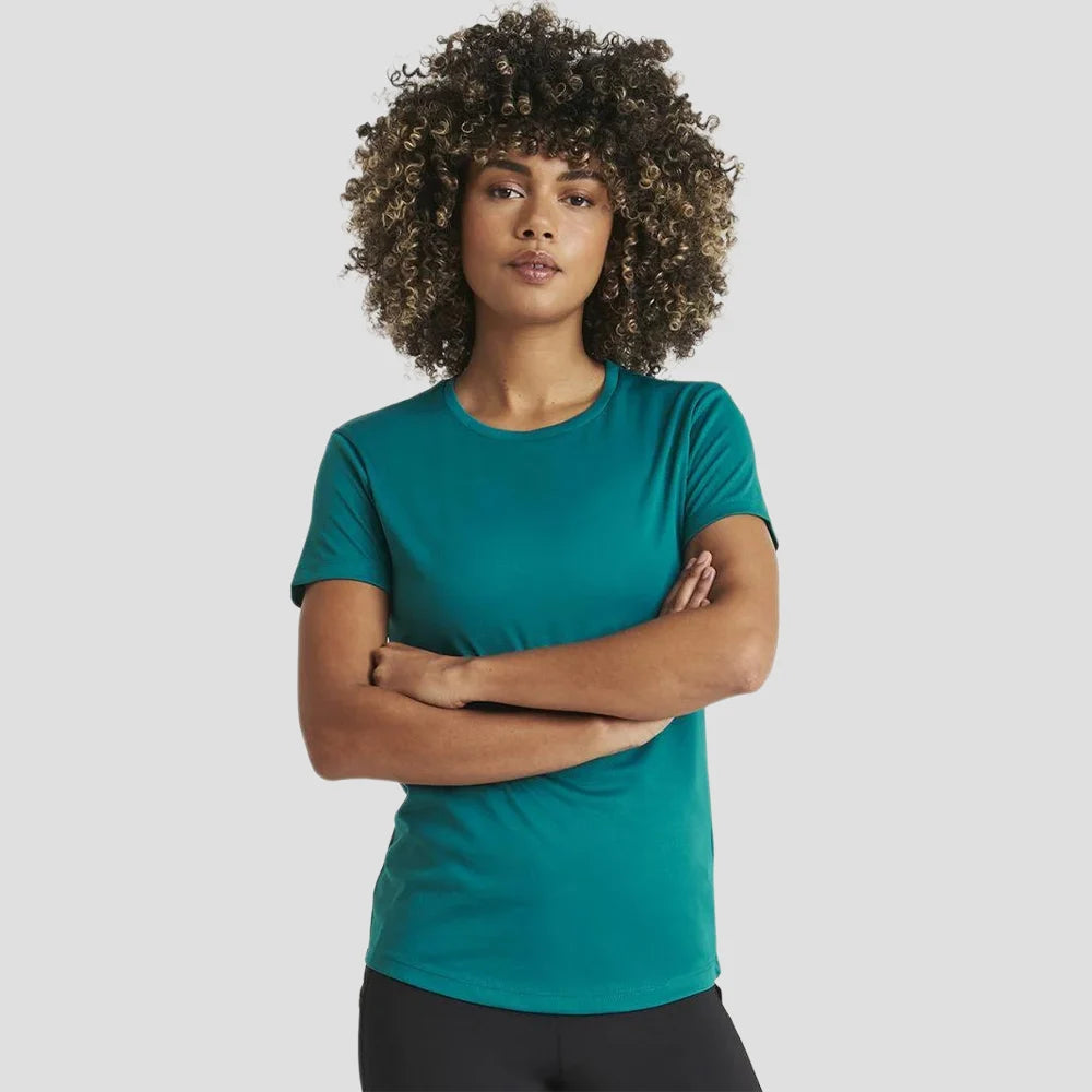 Model wearing the AWDis Ladies Cool T-Shirt JC005 in Jade Green