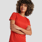Model wearing the AWDis Cool T-Shirt JC005 in Fire Red