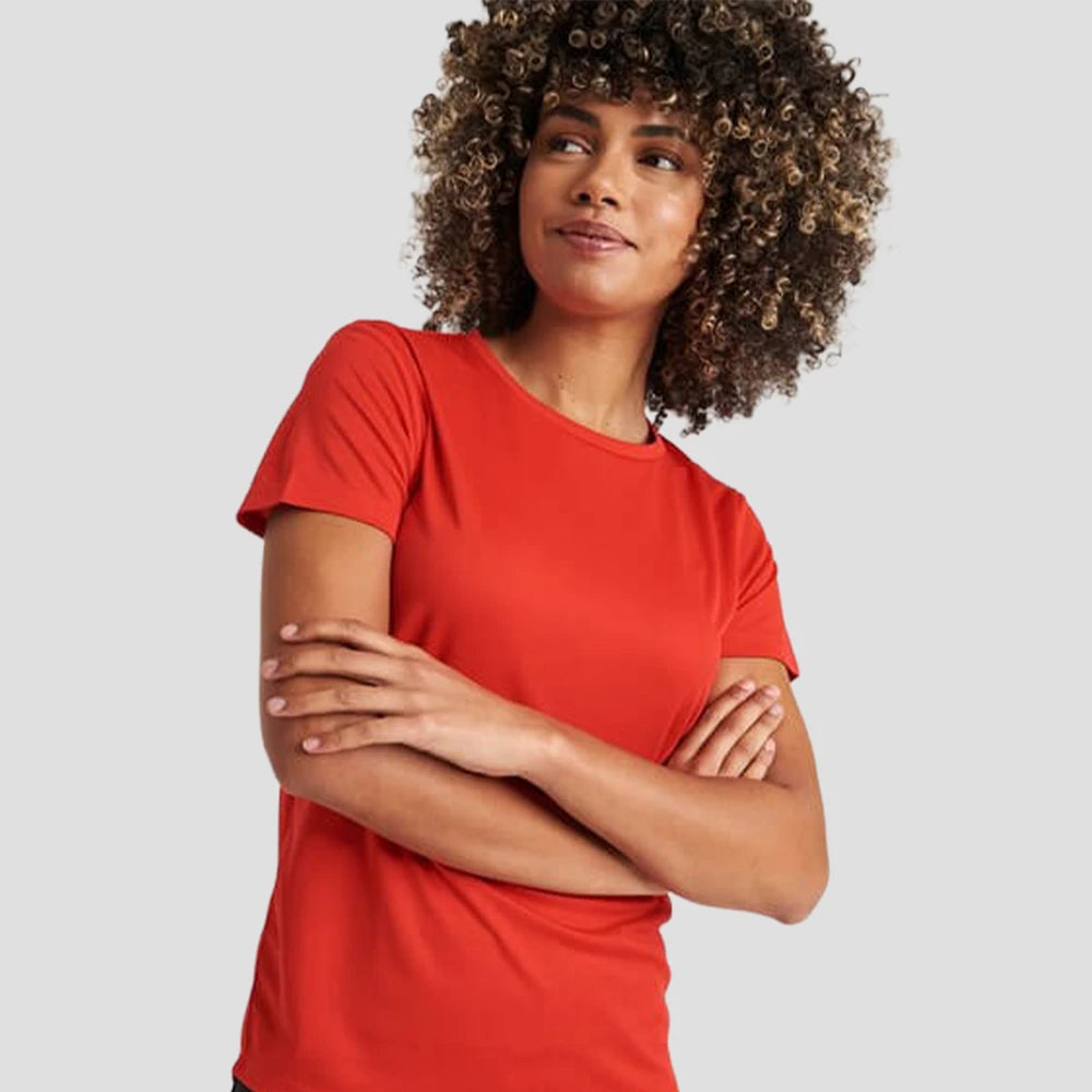 Model wearing the AWDis Cool T-Shirt JC005 in Fire Red