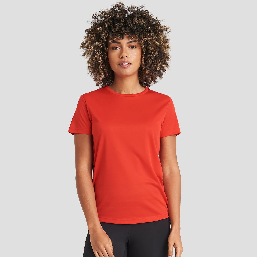 Model wearing the Ladies Cool T-Shirt JC005 in Fire Red