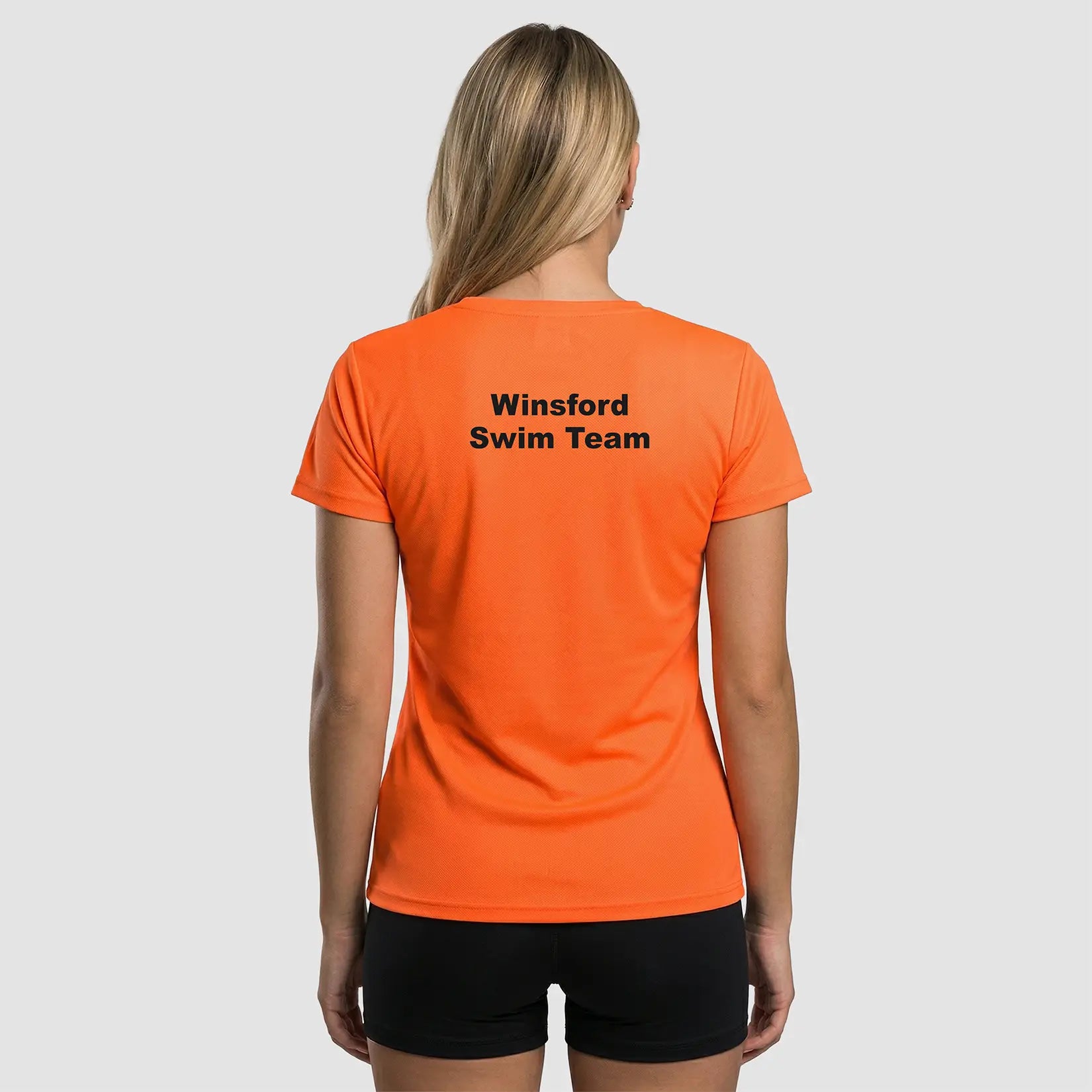 Rear view of Model wearing the Winsford ASC Team T-Shirt – Ladies (Orange) JC005