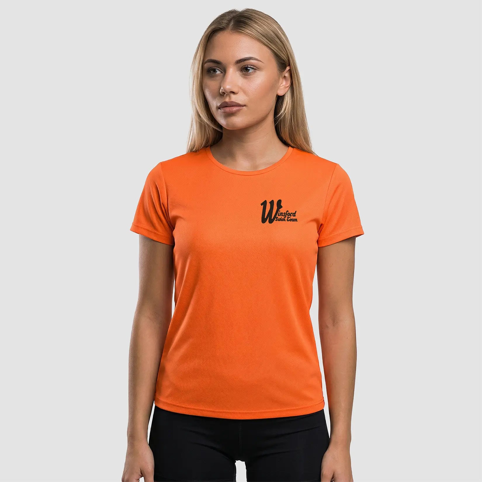 Model wearing the Winsford ASC Team T-Shirt – Ladies (Orange) JC005