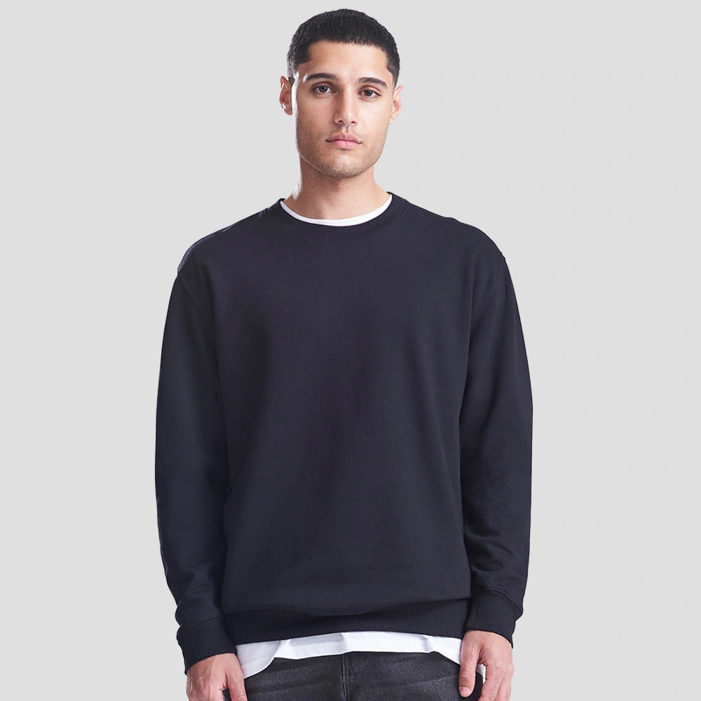 Model wearing the JH030 AWDis Sweatshirt in Deep Black