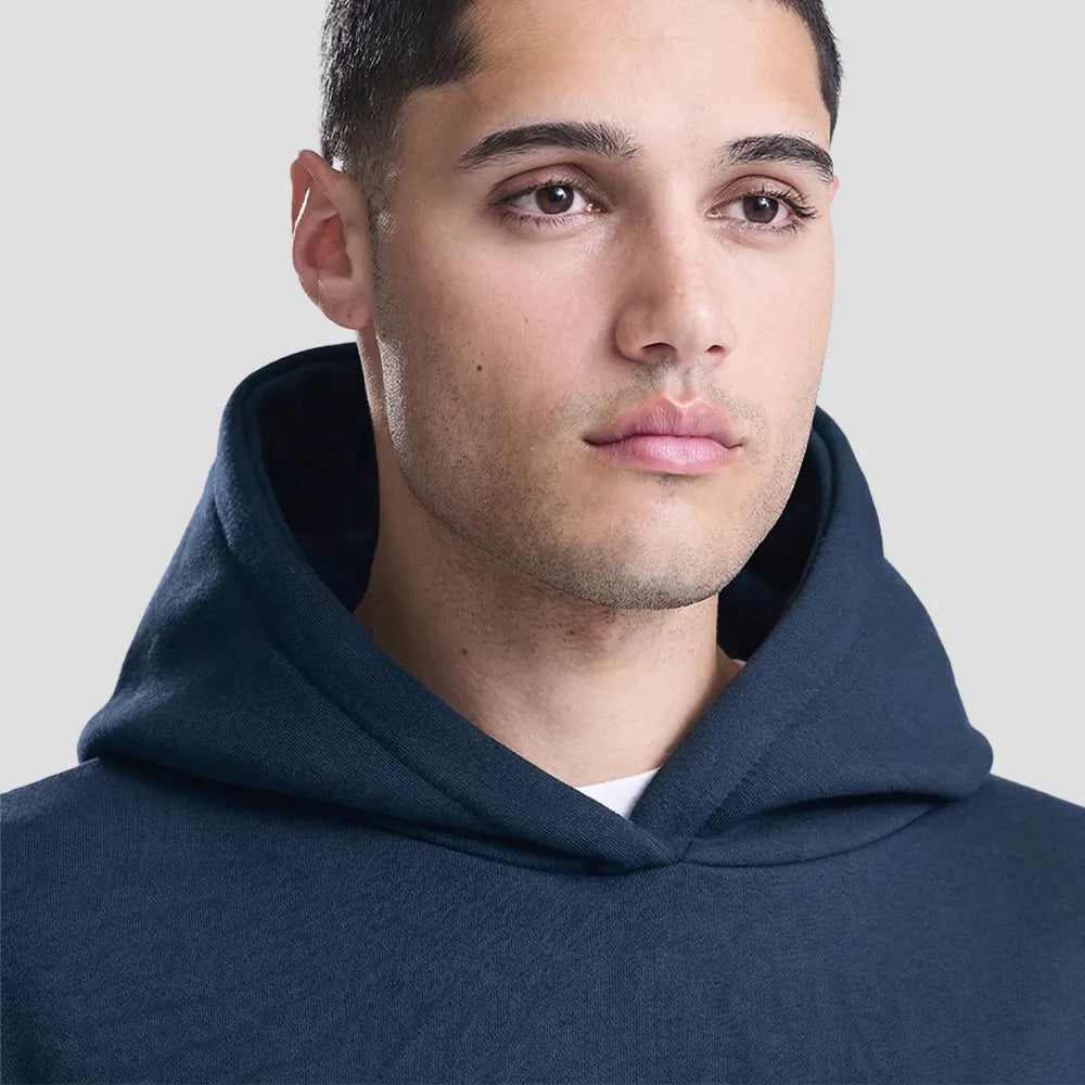 Close-up of model wearing the JH120 AWDis Heavyweight Signature Hoodie in New French Navy