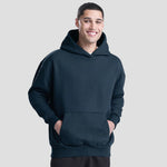 Model wearing the JH120 AWDis Heavyweight Signature Hoodie in New French Navy