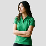 Model wearing the Ladies Eagle Polo Shirt 1160 in Kelly Green
