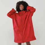 Model wearing the Finden Hales Unisex All-Weather Robe in Red.