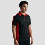 Model wearing the Orn Avocet Wicking Polo Shirt 1198 in Black / Red