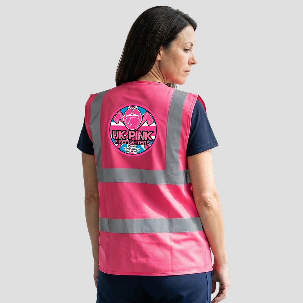 Rear view of Model wearing the Pink Fire Brigade High Visibility Waistcoat