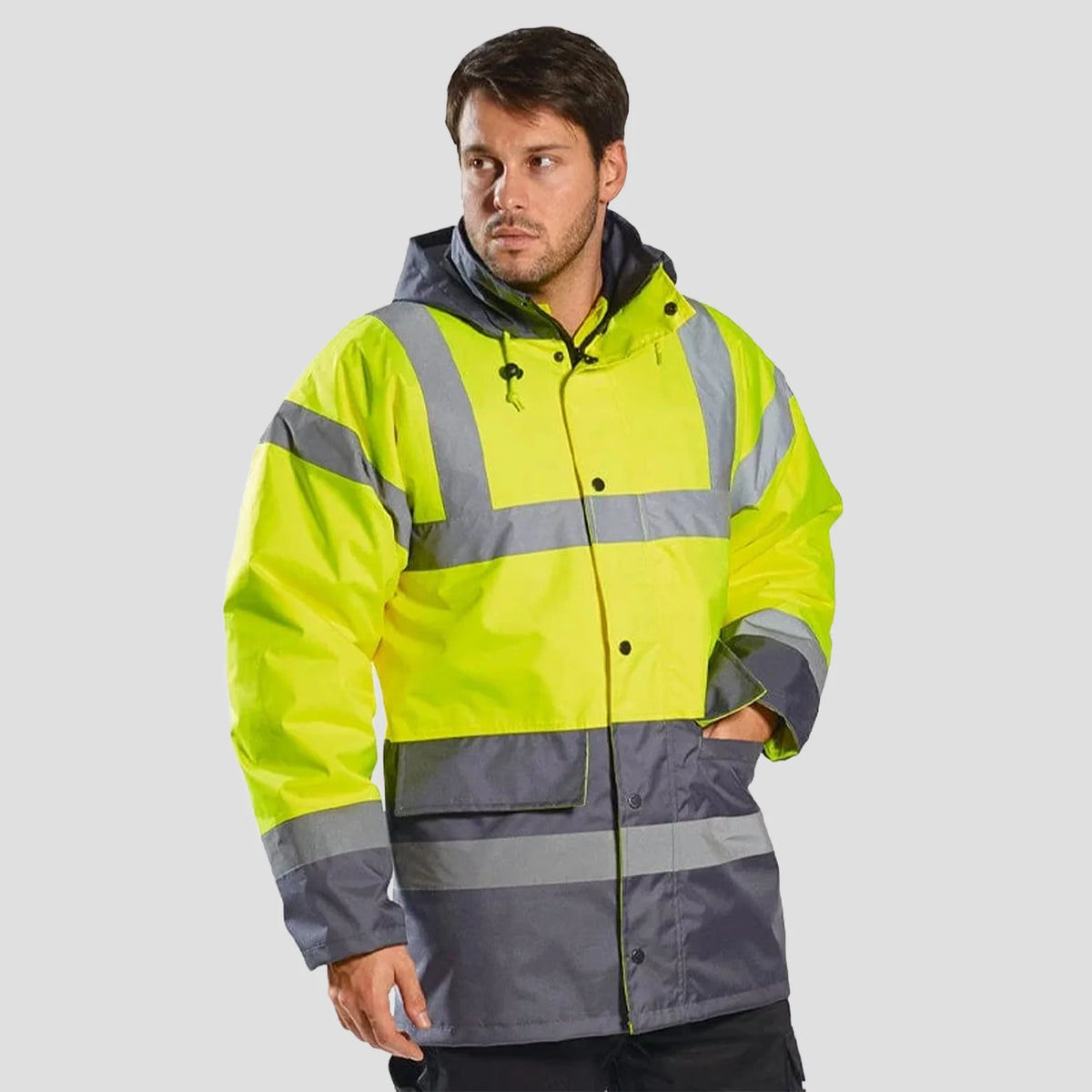 Model wearing Hi-Vis Contrast Winter Traffic Jacket in Yellow/Grey.