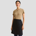 Model wearing the Premier Fairtrade Organic Cotton Waist Apron PR114.