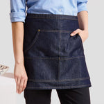 Close-up of model wearing the Premier Denim Waist Apron PR125.