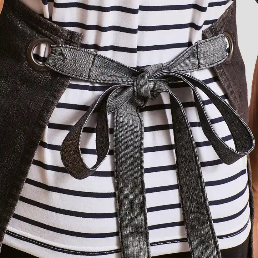 Back view of model wearing the Premier Domain Bib Apron PR127.