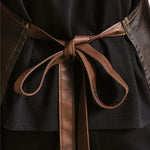 Back view of model wearing the Premier Division Bib Apron PR136.