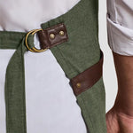 Close-up of model wearing the Premier Annex Oxford Bib Apron PR144.