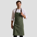 Model wearing the Premier Annex Oxford Bib Apron PR144.
