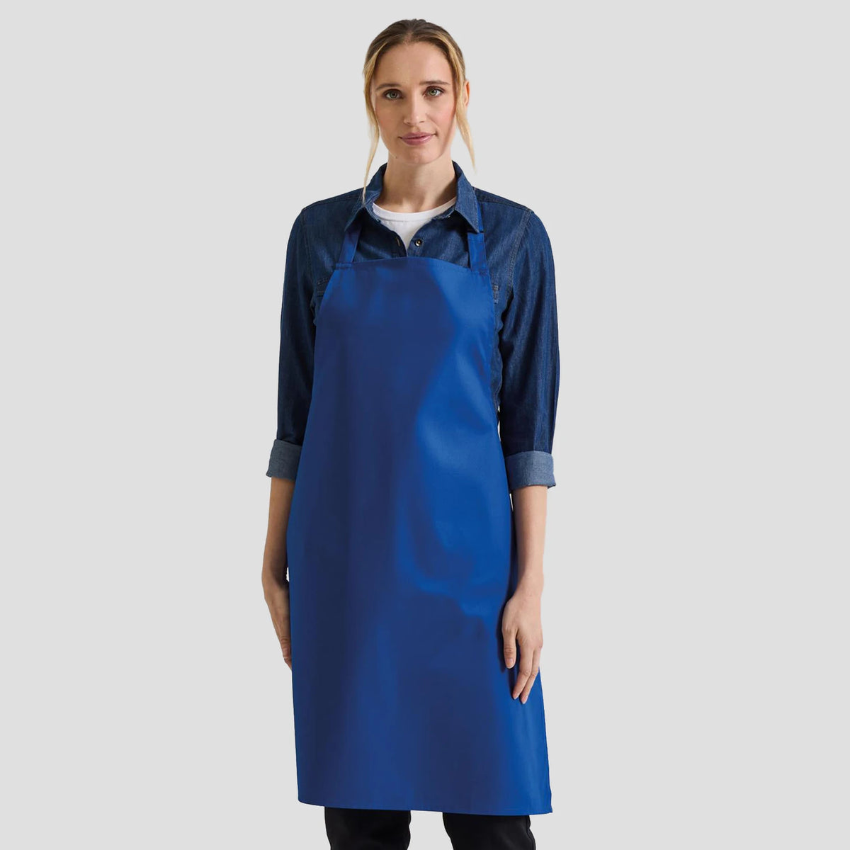 Model wearing the Premier 'Colours' Bib Apron PR150.