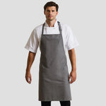 Model wearing the Premier 'Colours' Bib Apron PR150.