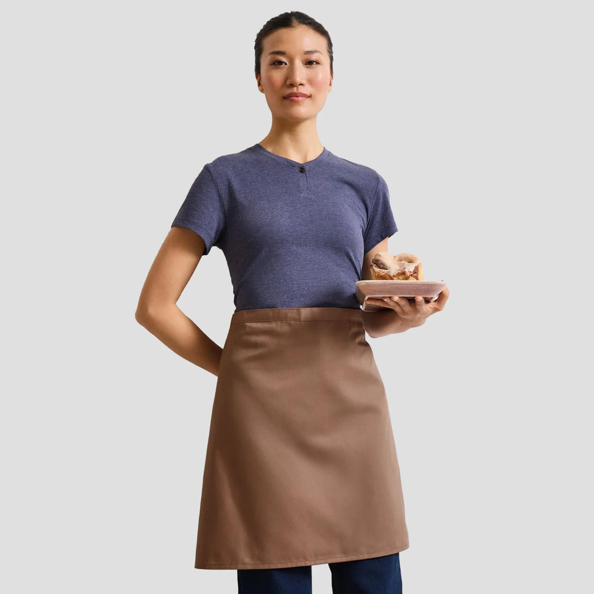Model wearing the Premier 'Colours' Mid Length Apron PR151.