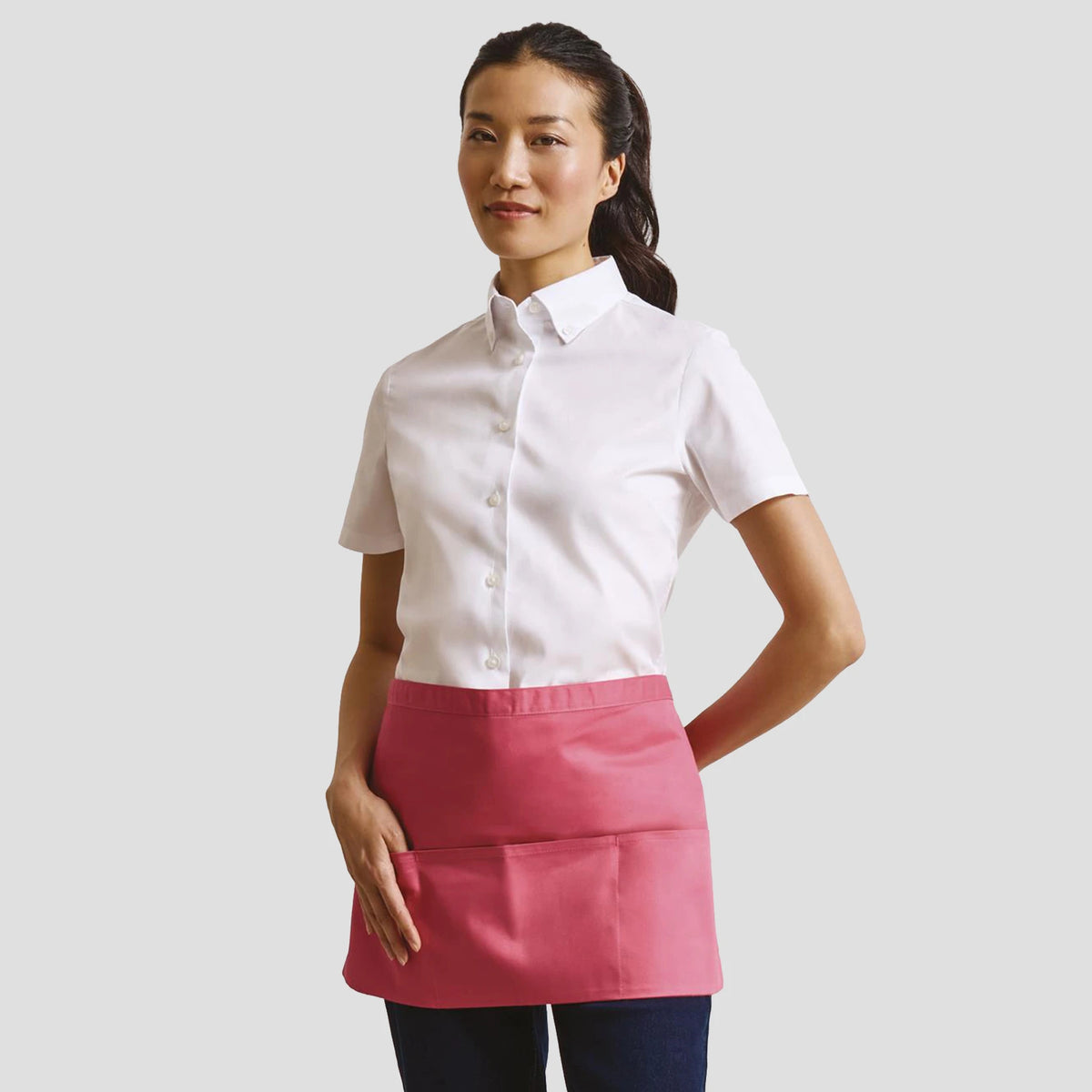 Model wearing the Premier 'Colours' 3 Pocket Apron PR155.
