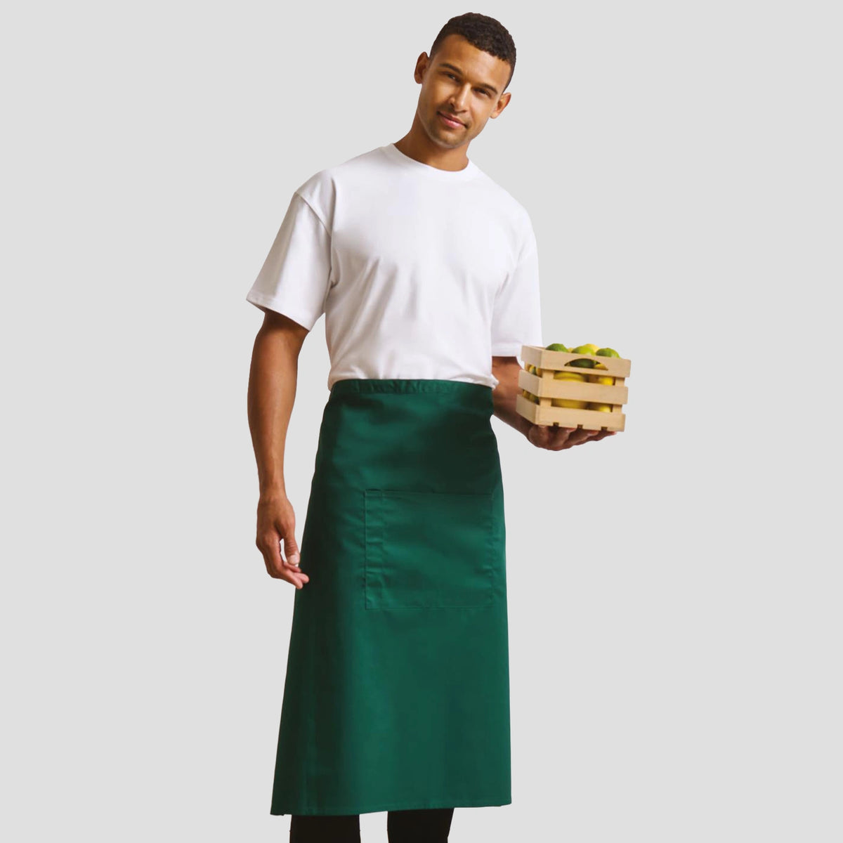 Model wearing the Premier 'Colours' Bar Apron PR158.