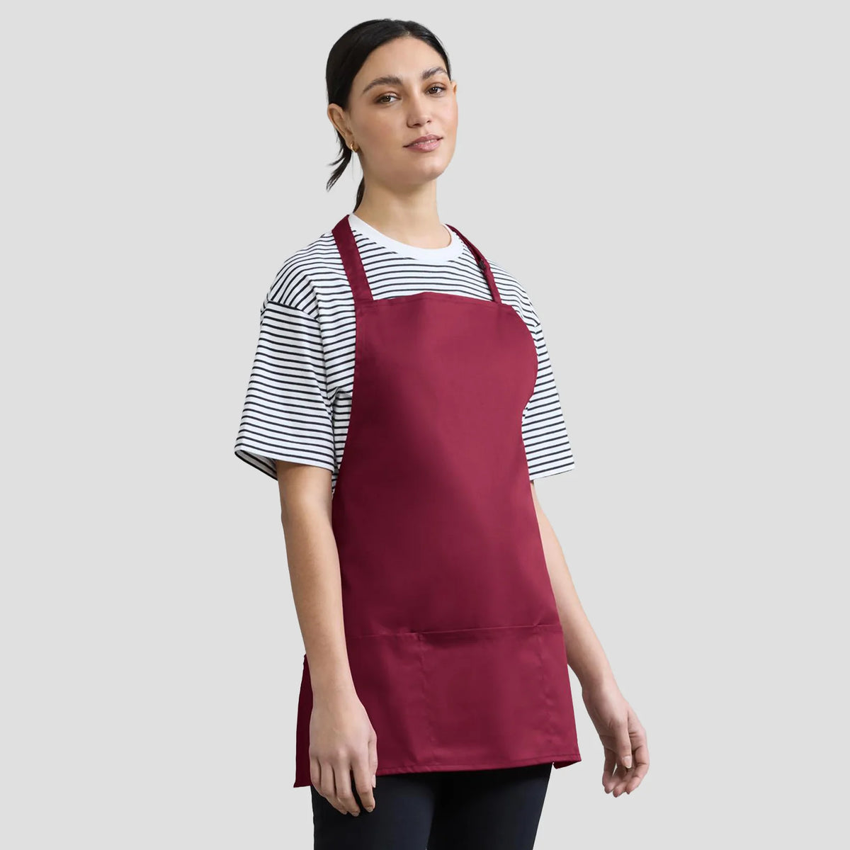 Model wearing the Premier 'Colours' 2-in-1 Apron PR159.