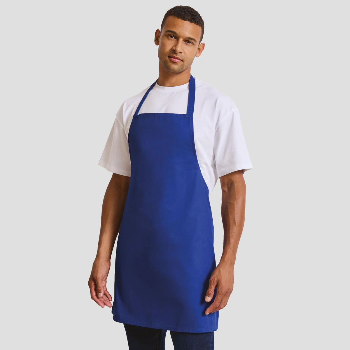 Model wearing the Premier Essential Bib Apron PR165.