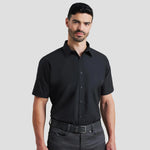 Model wearing the Premier Supreme Short Sleeve Poplin Shirt in Black.