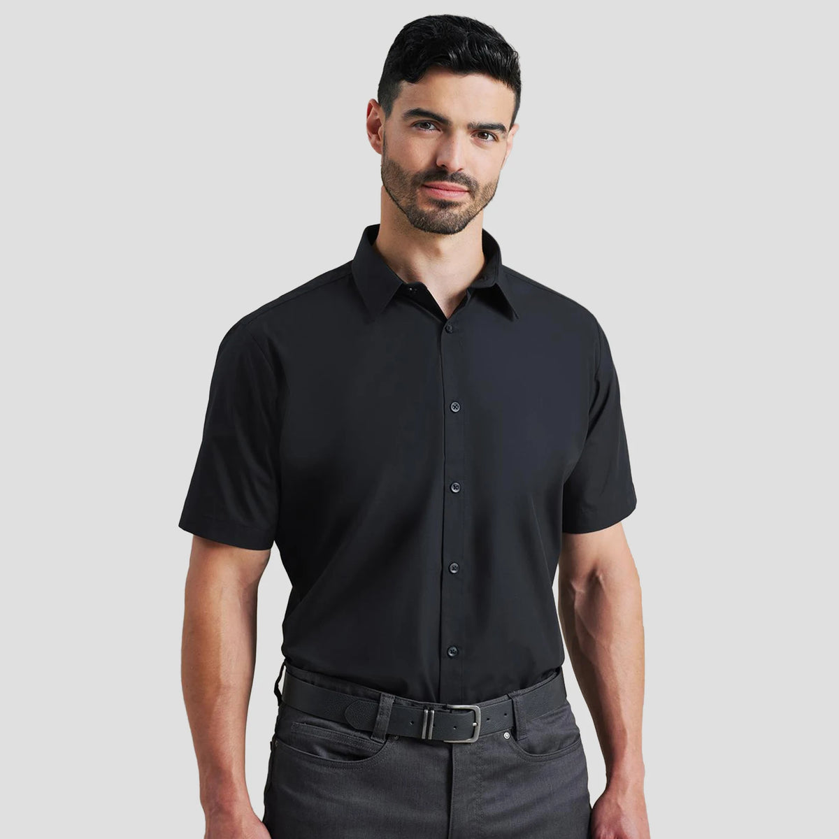 Model wearing the Premier Supreme Short Sleeve Poplin Shirt in Black.