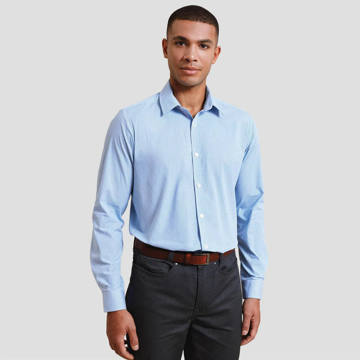Model wearing the Premier Gingham Long Sleeve Shirt PR220.