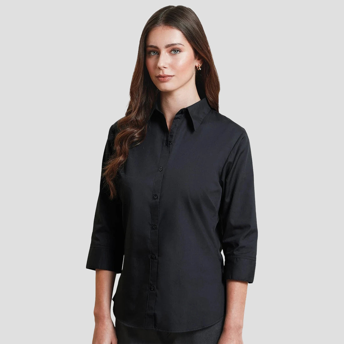 Model wearing the Premier Ladies 3/4 Sleeve Poplin Blouse PR305 in Black.