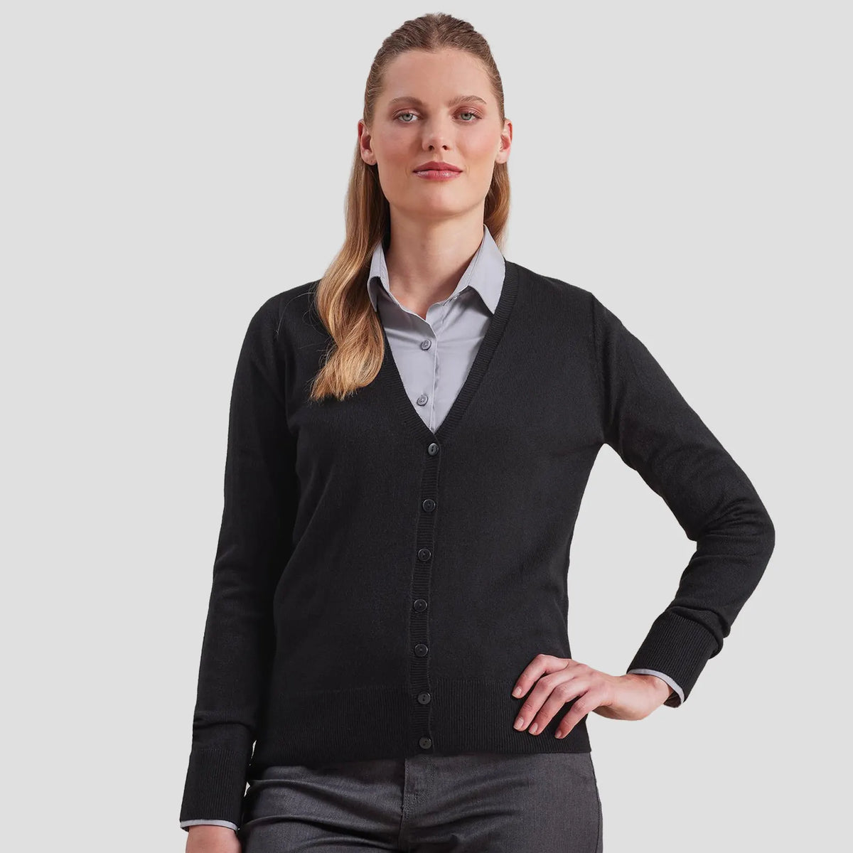 Model wearing the Premier Ladies Essential Acrylic V Neck Cardigan PR402.
