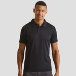 Male model wearing the Premier Coolchecker® Stud Piqué Polo Shirt PR612 in Black