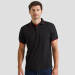 Model wearing the Premier Contrast Coolchecker® Piqué Polo Shirt PR618 in Black / Red