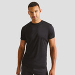 Model wearing the Premier Coolchecker® Chef's T-Shirt PR649 in Black.
